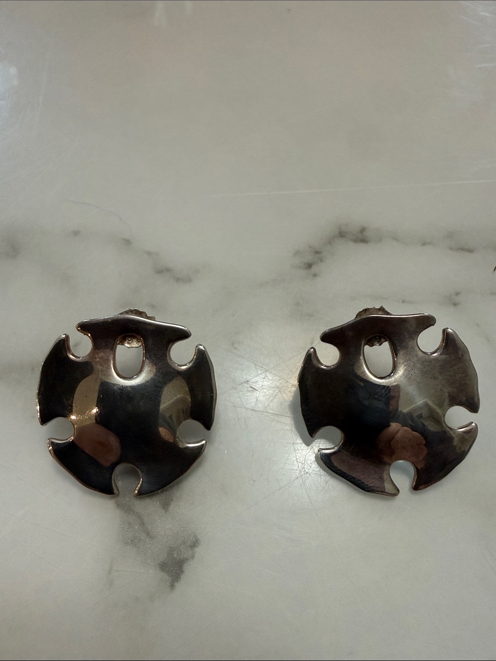 RLM Studios silver sand dollar clip-on earrings
